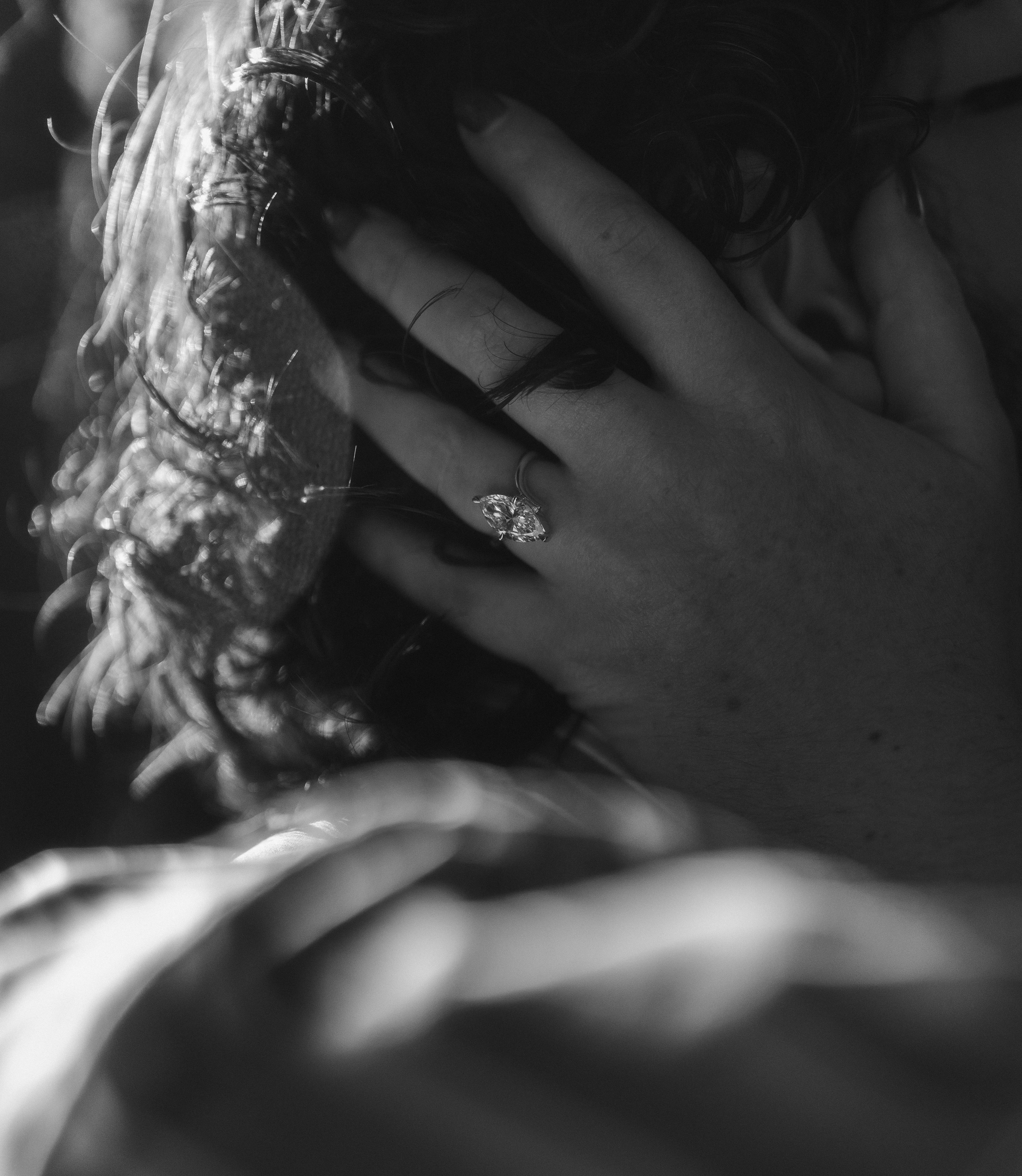 Close-up of Melissa's engagement ring in autumn light